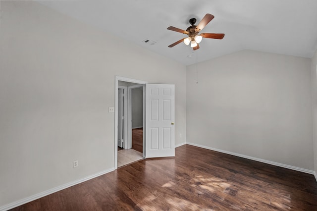 unfurnished room with lofted ceiling, dark hardwood / wood-style floors, and ceiling fan