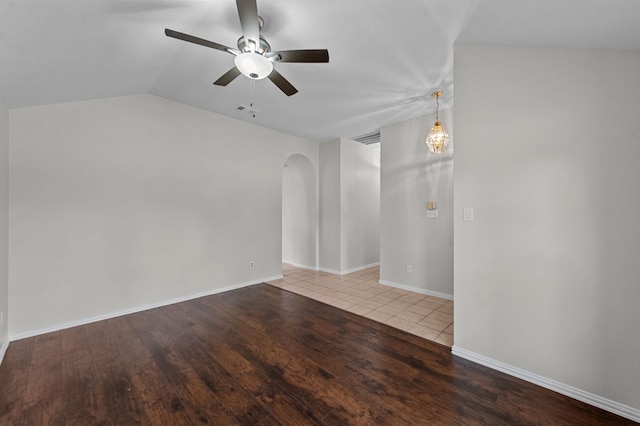 spare room with ceiling fan, hardwood / wood-style flooring, and lofted ceiling