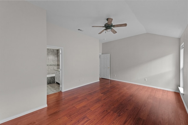 unfurnished room featuring hardwood / wood-style flooring, vaulted ceiling, and ceiling fan