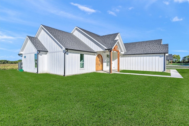 modern farmhouse with a front lawn