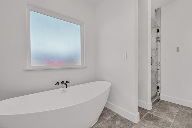 bathroom featuring separate shower and tub