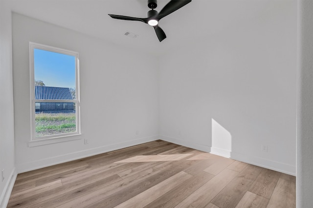 empty room with light wood-type flooring and ceiling fan