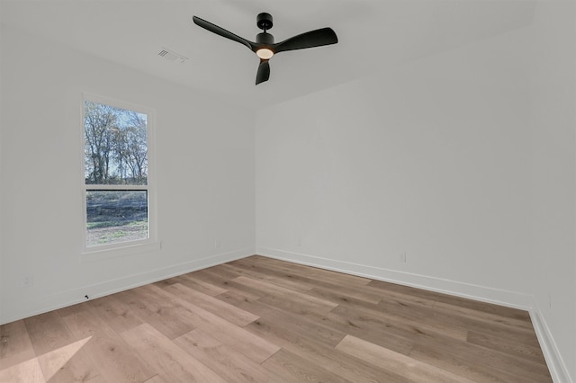 spare room featuring ceiling fan and light hardwood / wood-style floors