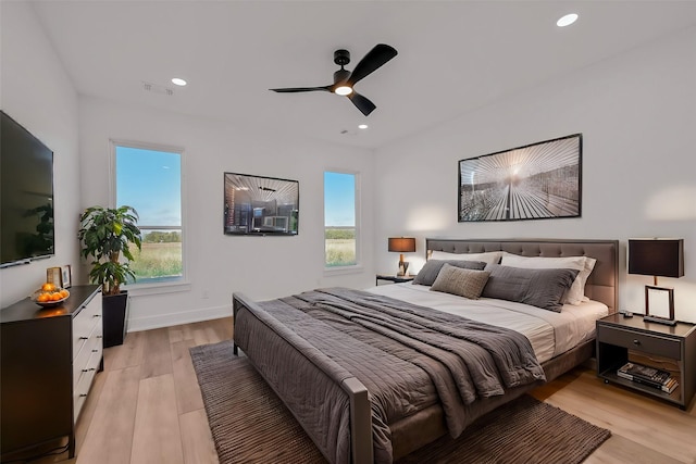 bedroom featuring ceiling fan and light hardwood / wood-style floors