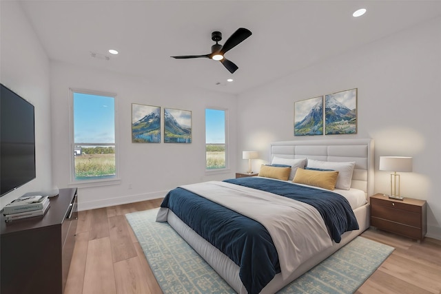 bedroom featuring ceiling fan and light hardwood / wood-style flooring