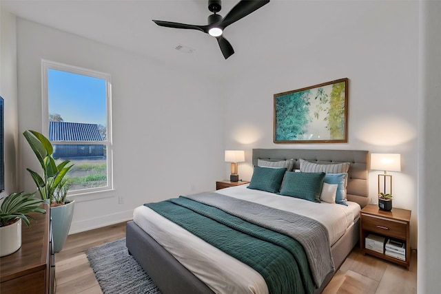 bedroom featuring ceiling fan and light hardwood / wood-style flooring