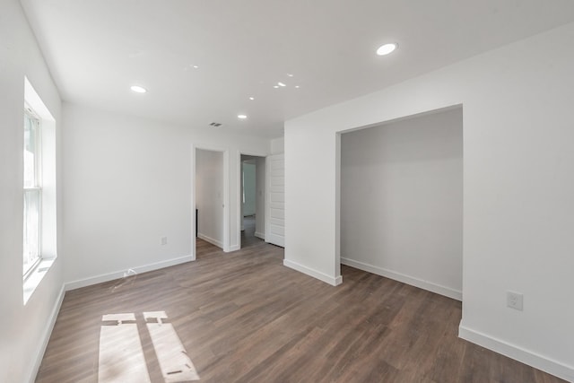 unfurnished bedroom featuring dark hardwood / wood-style flooring