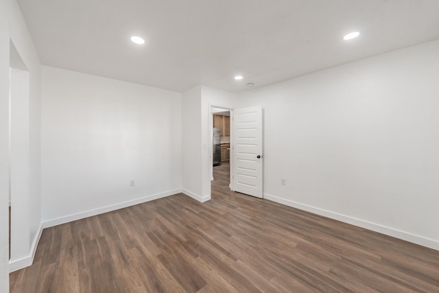 empty room featuring dark hardwood / wood-style floors