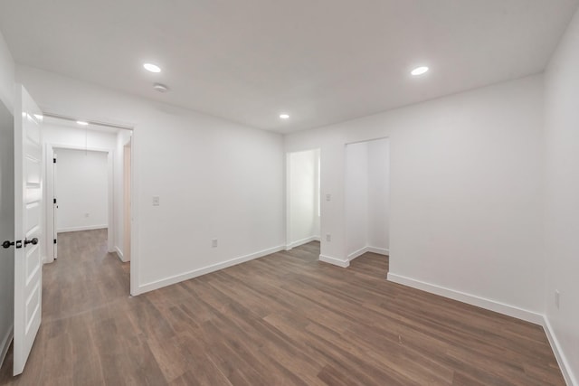 spare room with dark hardwood / wood-style flooring