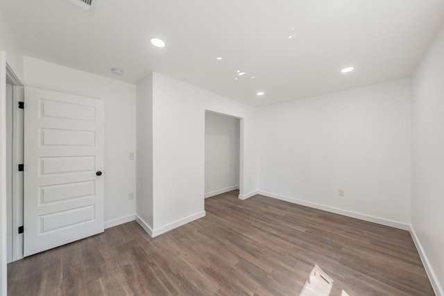 unfurnished room featuring dark hardwood / wood-style floors