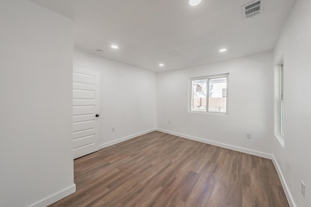 empty room featuring dark wood-type flooring