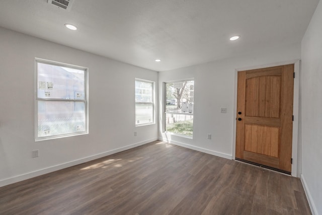 entryway with dark hardwood / wood-style floors