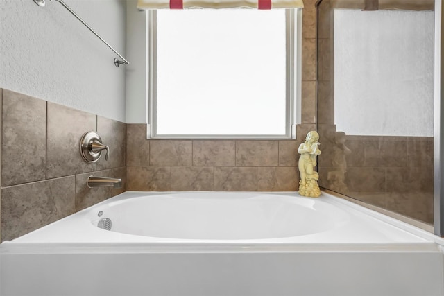 full bathroom with a garden tub