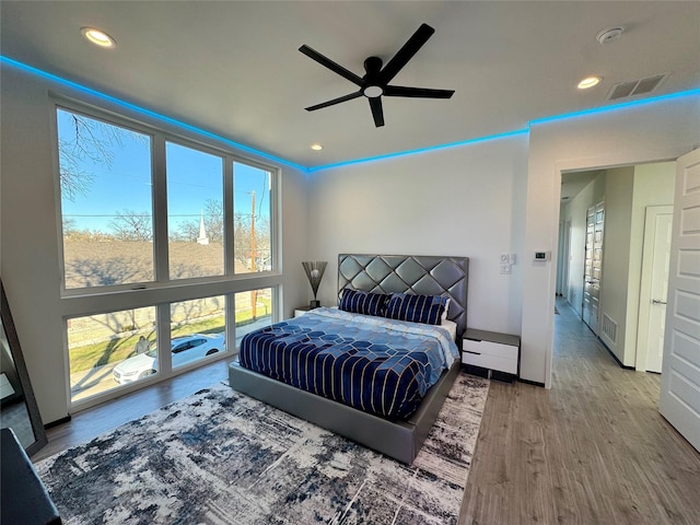 bedroom featuring wood-type flooring and ceiling fan