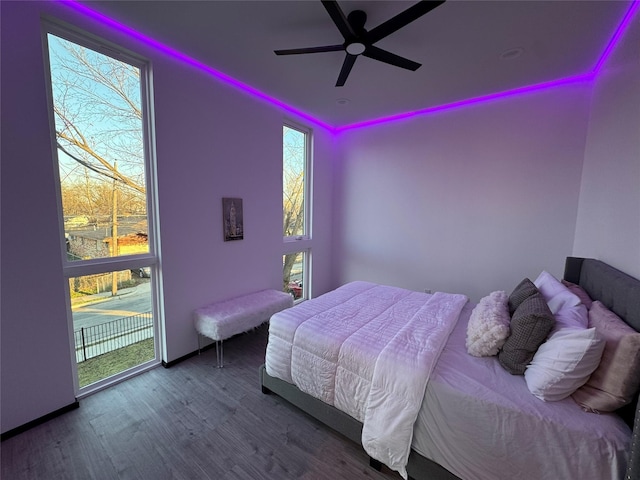 bedroom featuring wood-type flooring and ceiling fan