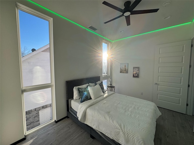 bedroom featuring wood-type flooring and ceiling fan