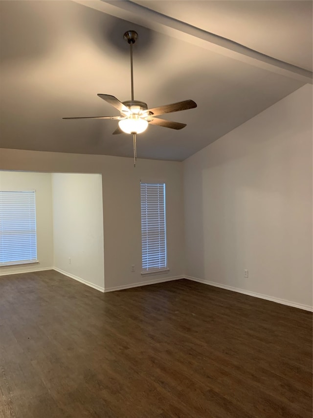 empty room featuring dark wood-type flooring, ceiling fan, and vaulted ceiling