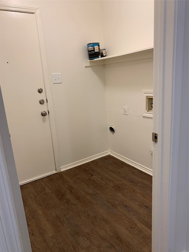 clothes washing area featuring electric dryer hookup and dark hardwood / wood-style floors