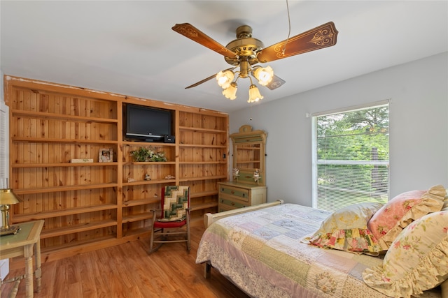 bedroom with hardwood / wood-style floors and ceiling fan