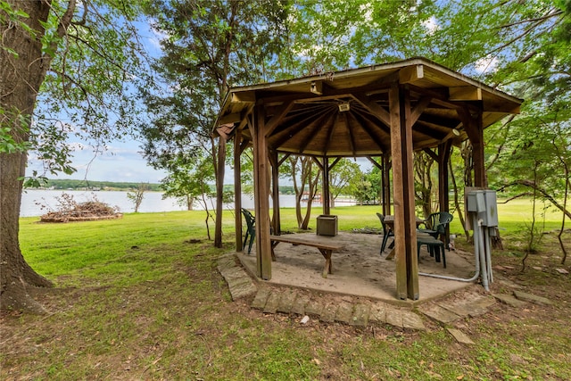 surrounding community featuring a water view, a gazebo, and a yard