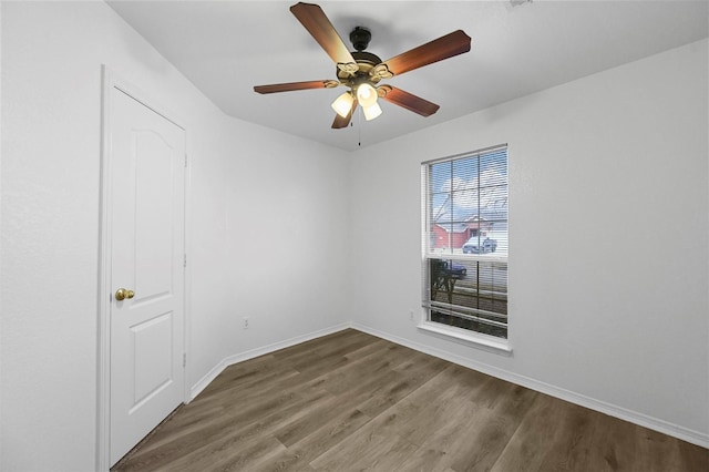 unfurnished room with ceiling fan and hardwood / wood-style flooring