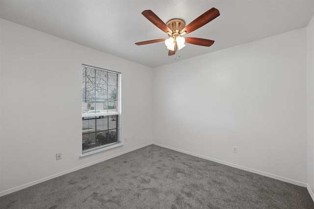 unfurnished room featuring ceiling fan and carpet flooring