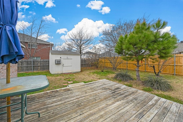 deck with a lawn and a shed