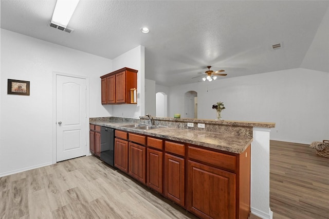 kitchen with ceiling fan, dishwasher, kitchen peninsula, sink, and a textured ceiling