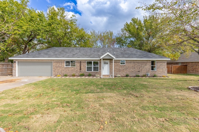 single story home featuring a garage and a front yard