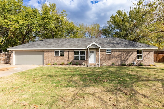 single story home with a garage and a front lawn