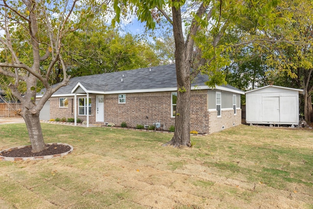 view of front of home featuring a shed and a front lawn