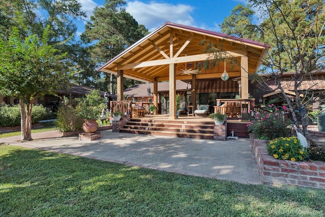 view of home's community with a lawn, a gazebo, and a patio