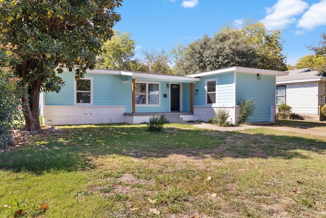 ranch-style house with a front lawn