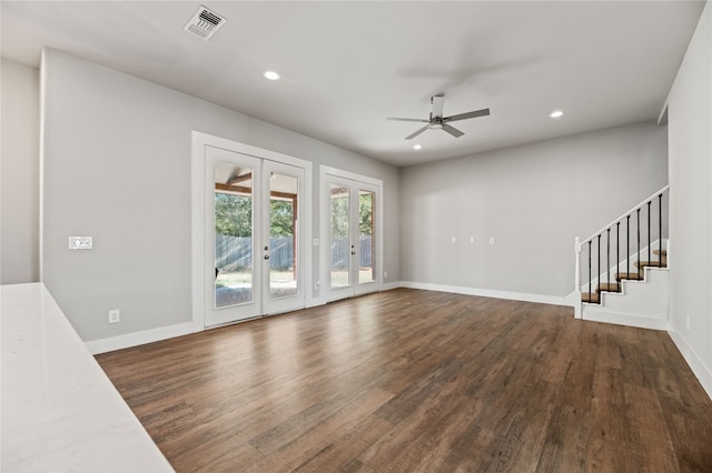 unfurnished living room with french doors, ceiling fan, and dark hardwood / wood-style floors