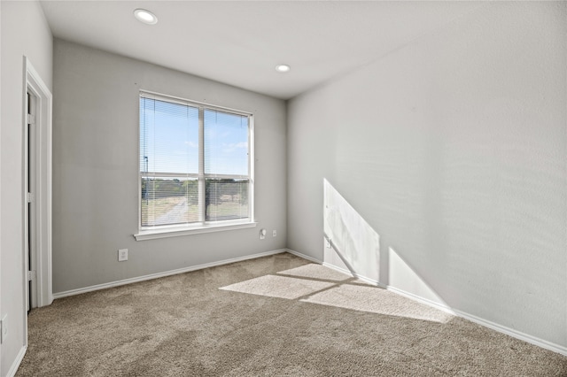 unfurnished room featuring carpet flooring