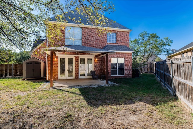 back of house with a patio, a storage shed, and a yard