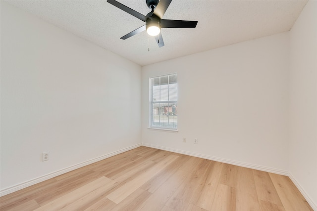 unfurnished room featuring a textured ceiling, hardwood / wood-style flooring, and ceiling fan