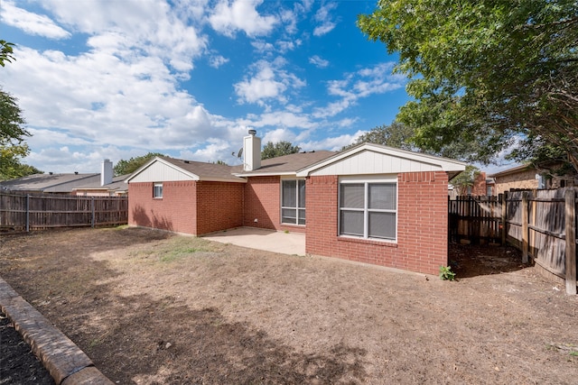 rear view of house featuring a patio area