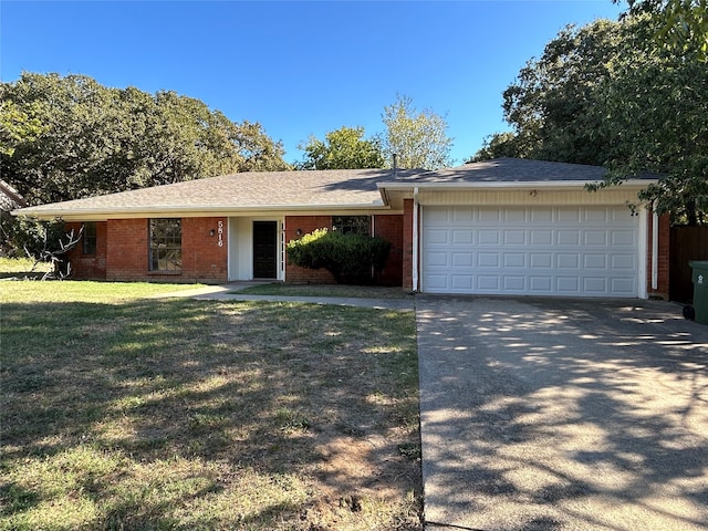 single story home with a front yard and a garage