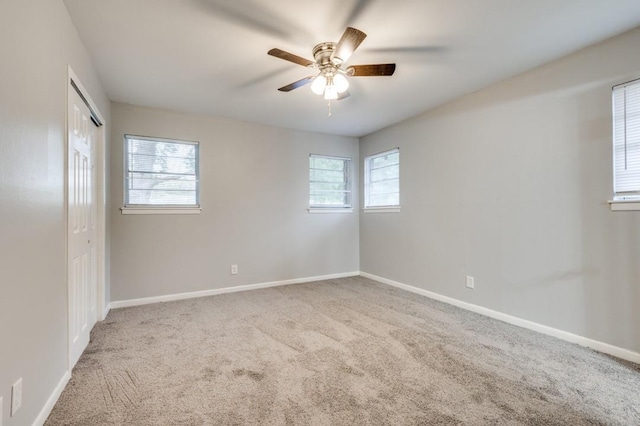 spare room featuring carpet floors and ceiling fan