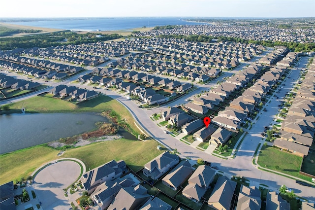 drone / aerial view with a water view