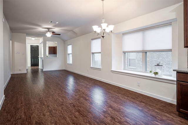2418 San Marcos Dr, Forney, TX 75126 - unfurnished living room with dark wood-style floors, baseboards, visible vents, ceiling fan with notable chandelier, and lofted ceiling