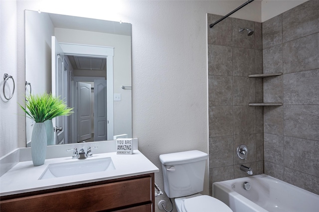 full bathroom with toilet, tiled shower / bath combo, and vanity