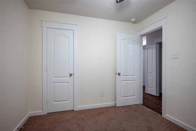 2418 San Marcos Dr, Forney, TX 75126 - unfurnished bedroom featuring baseboards and carpet