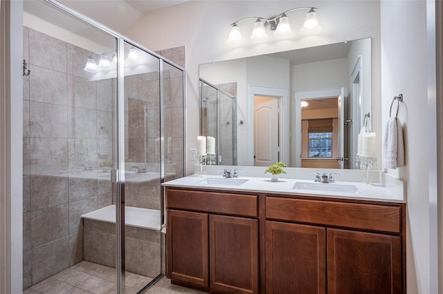 bathroom featuring an enclosed shower and vanity