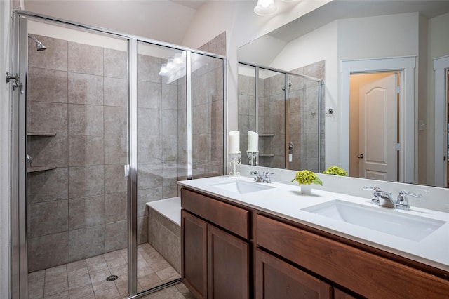 bathroom with walk in shower and vanity