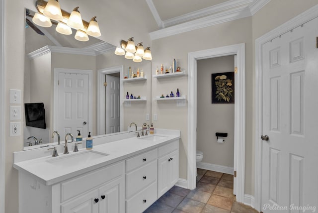 bathroom with vanity, toilet, and ornamental molding