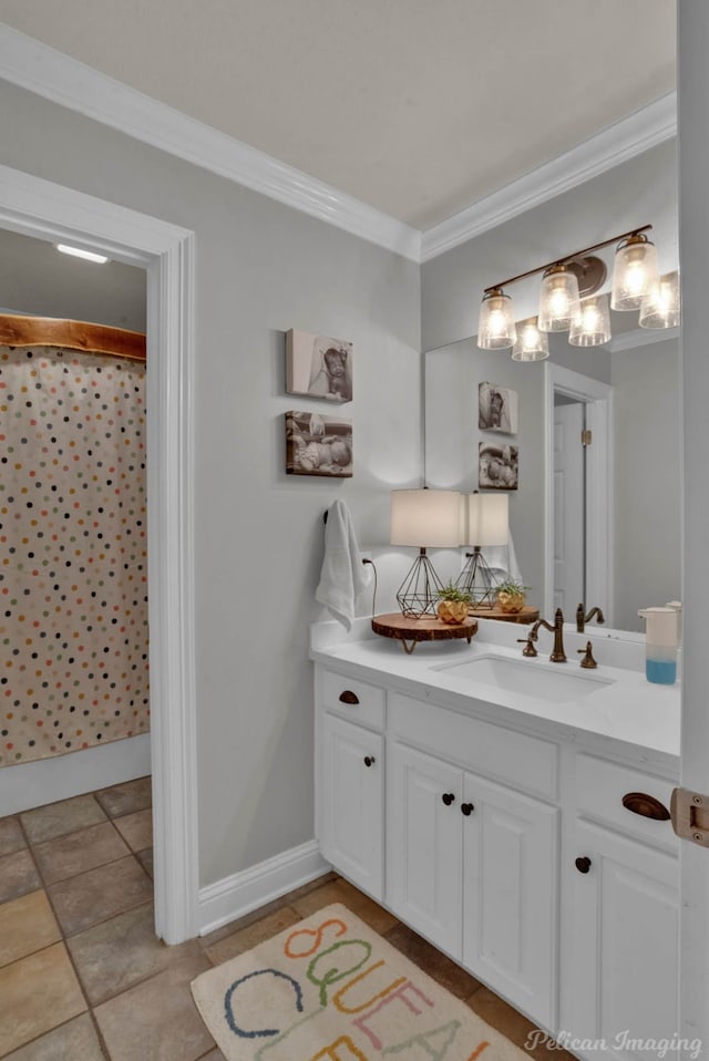 bathroom with tile patterned floors, crown molding, and vanity