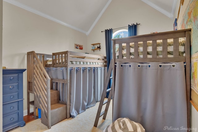 carpeted bedroom featuring crown molding and lofted ceiling