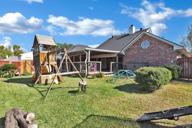 view of jungle gym with a lawn